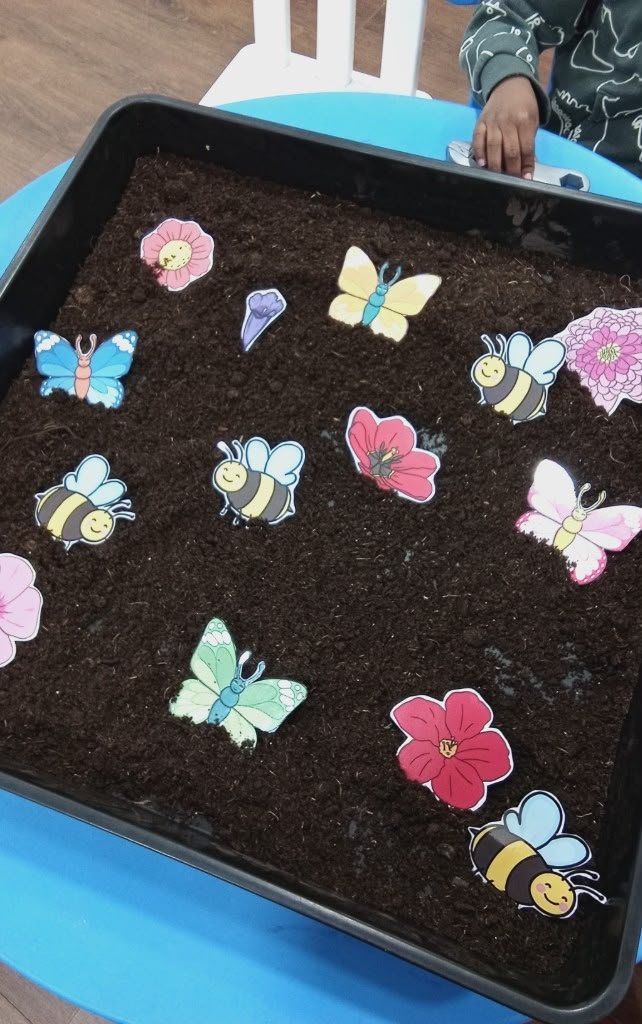 A colourful sensory tray set up for creative play
