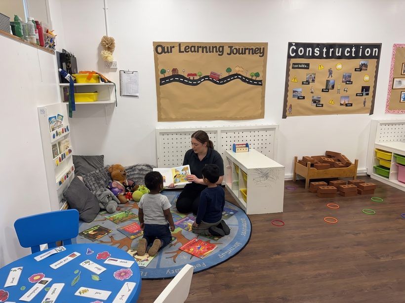 The book corner of the Golden Kidz Daycare preschool room, with its Learning Journey display and reading rug